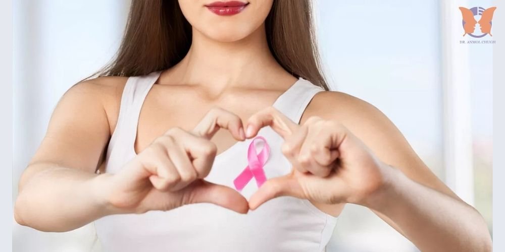 Confident breast cancer survivor after breast reconstruction surgery smiling in front of mirror Confident breast cancer survivor after breast reconstruction surgery smiling in front of mirror